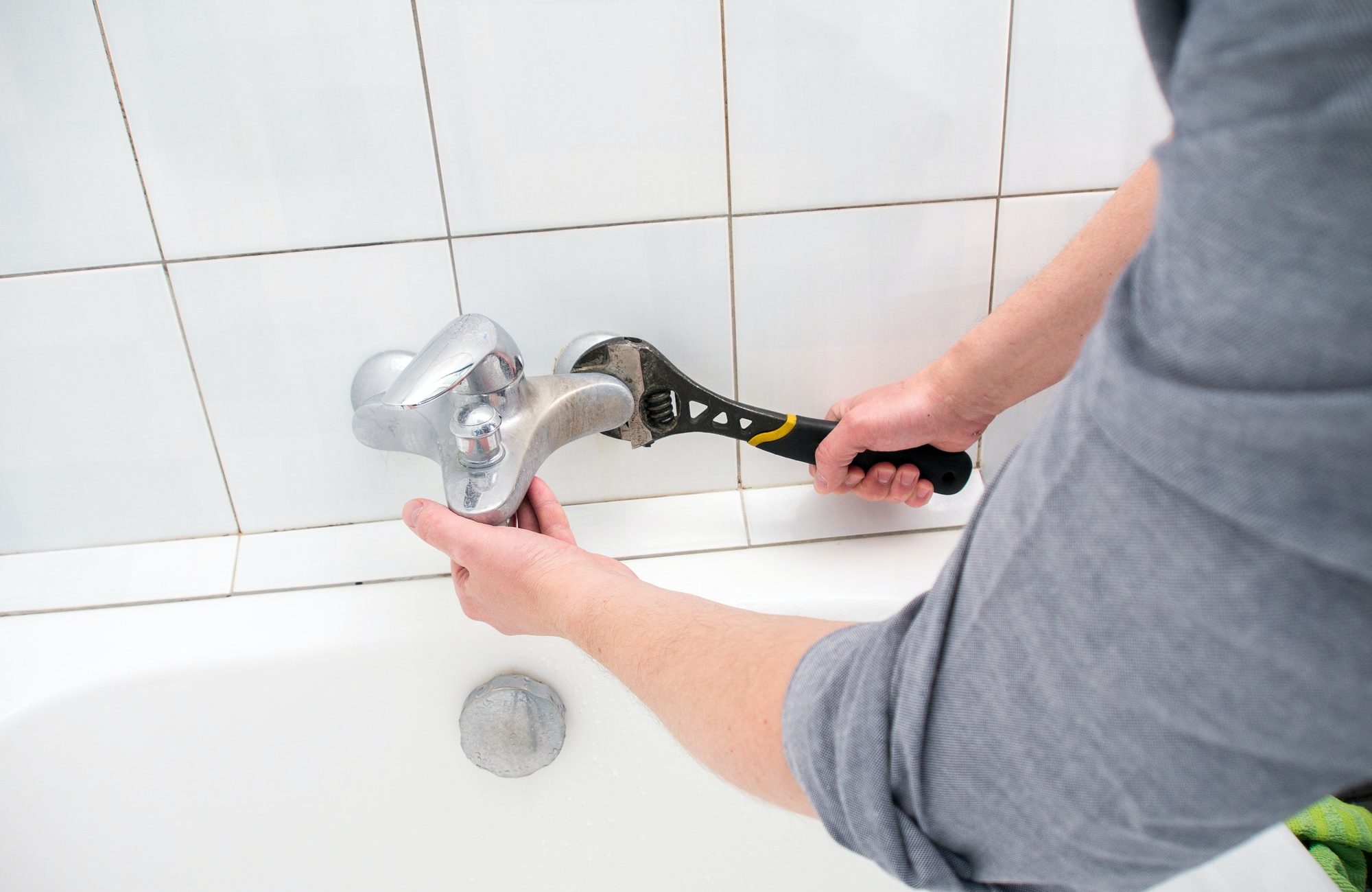 Plumber uninstalling faucet